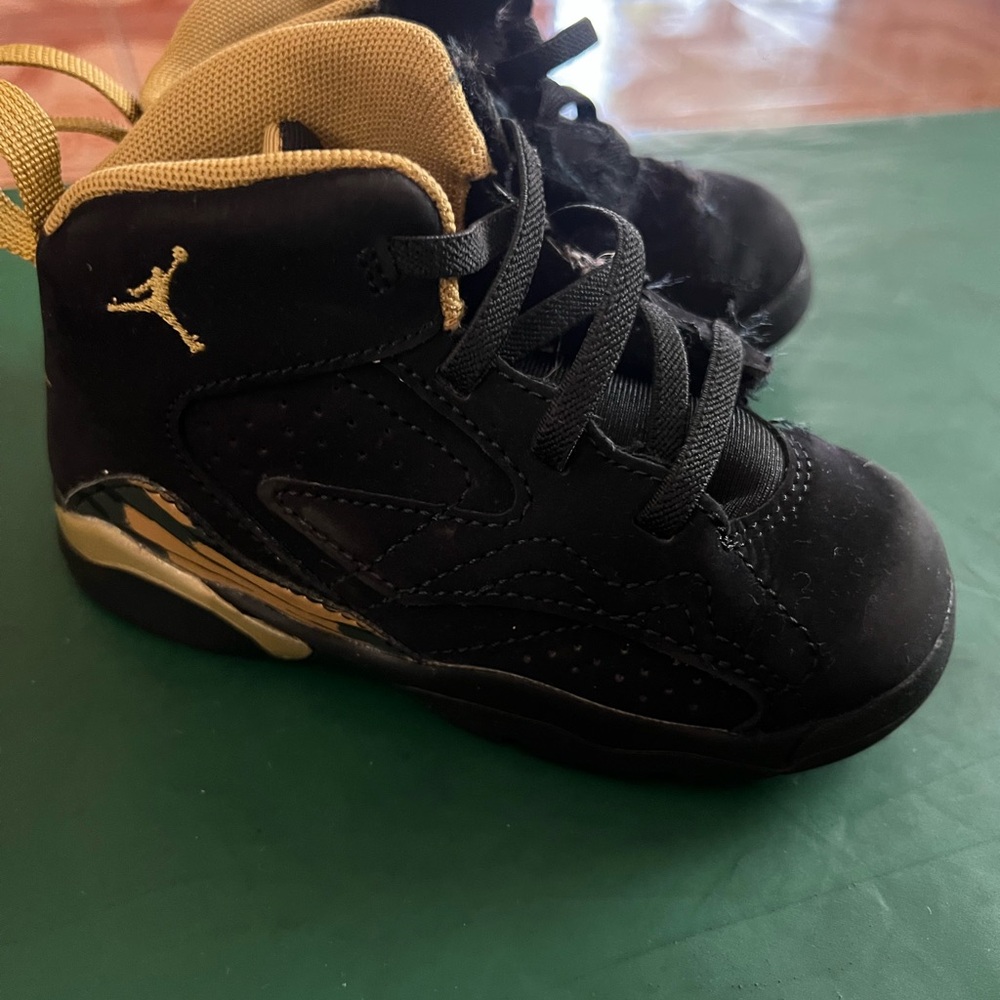 Jordan Black and Gold High-Top Sneakers